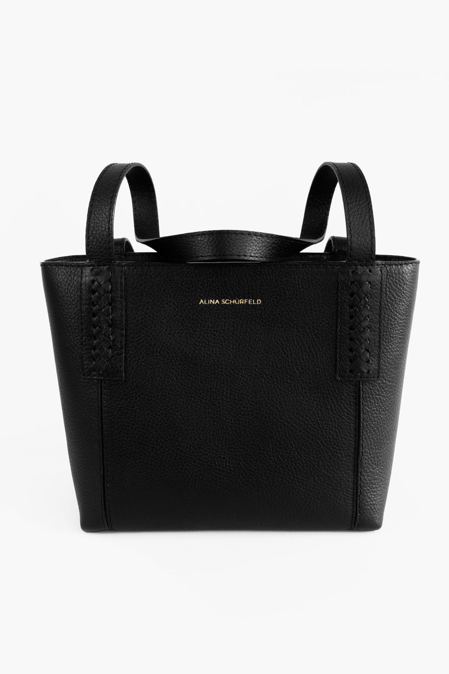 Black Wanda Tote by Alina Schürfeld, Made in Germany. The premium vegetable tanned leather, sculptural braided handle and clean silhouette reflect the brand's commitment to craftsmanship, sustainability and modern design. 