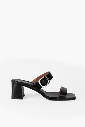 Black sandal with a block heel and gold buckle made from metal-free leather. Handmade in Germany by Alina Schürfeld. 