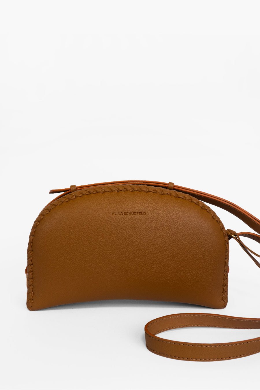 discover the perfect blend of craftsmanship, style, and sustainability with the Vanessa Bag, a stunning shoulder bag handmade in Germany. Meticulously crafted by skilled artisans, this masterpiece features exquisite hand-braiding that adds a personal touch to its modern, minimalist design. Made in Germany by Alina Schürfeld.