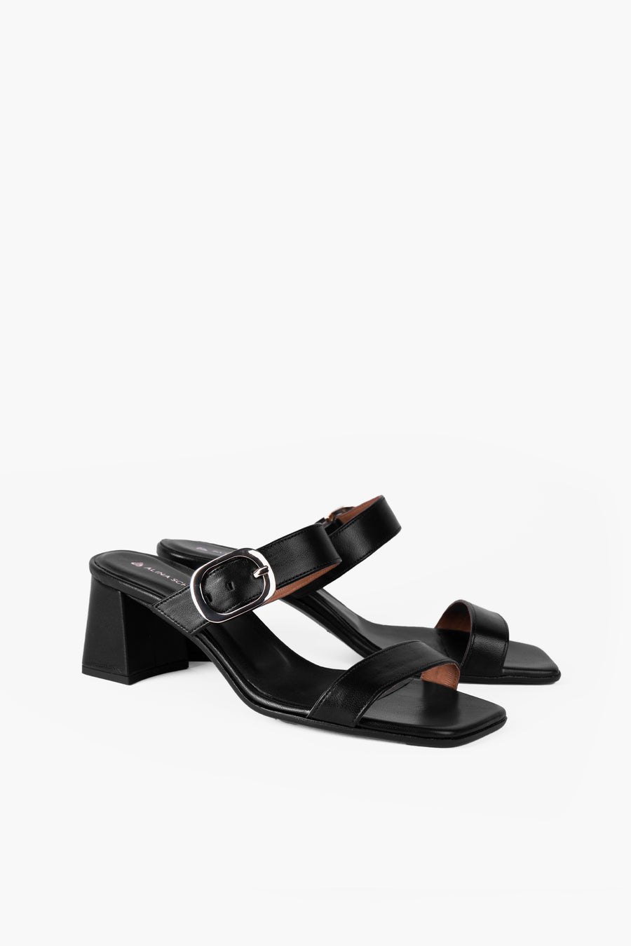 Black sandal with a block heel and gold buckle made from metal-free leather. Handmade in Germany by Alina Schürfeld. 