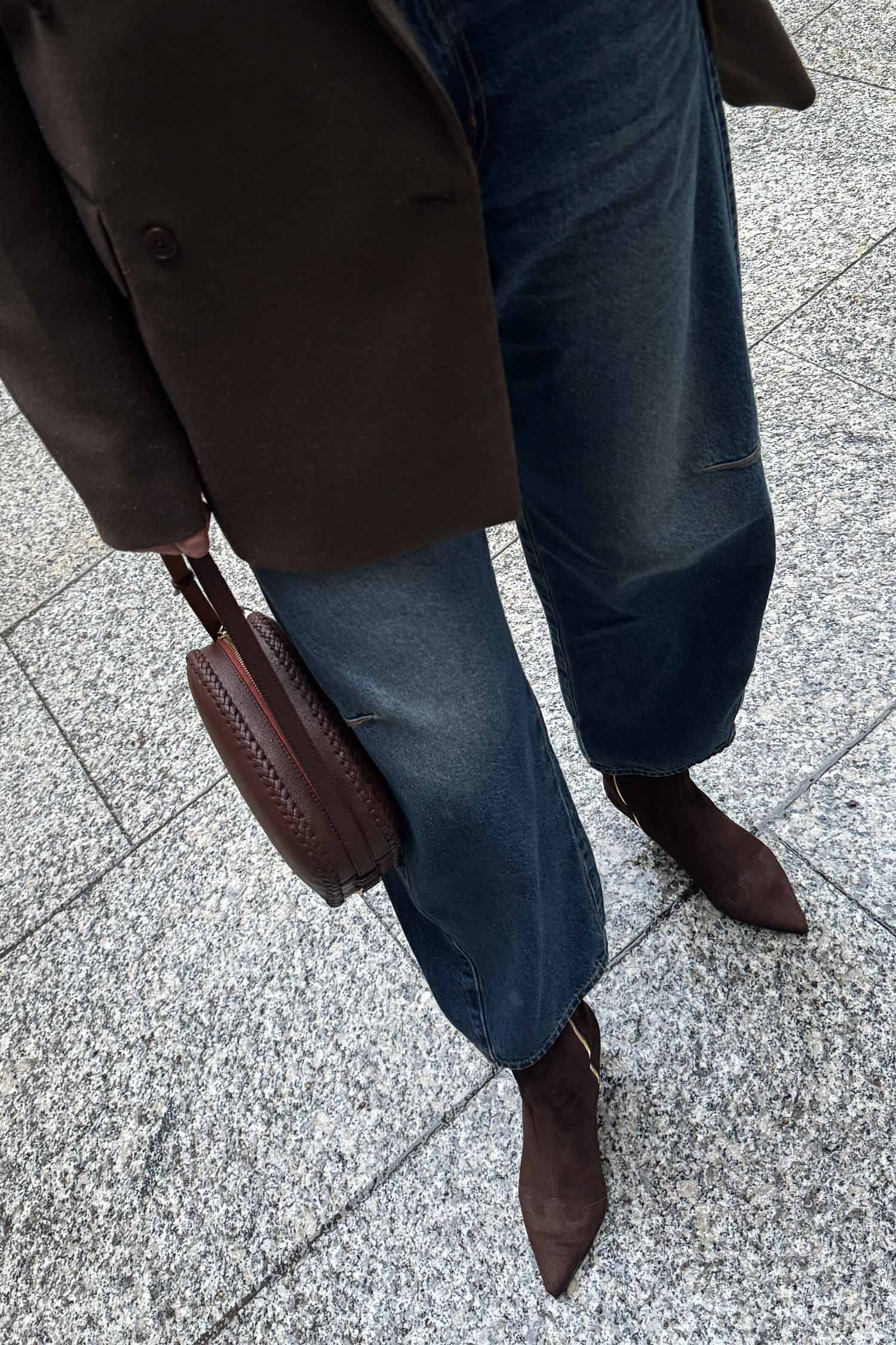 Pair of WIV ankle boots by Alina Schürfeld in Crisp Cacao suede, Texan-inspired pointed toe, clean minimalist silhouette, front view. Made in Germany. 