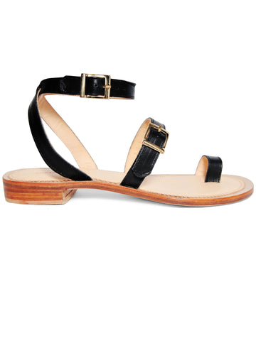 Black coloured, sustainable sandal with golden buckles by ALINASCHUERFELD