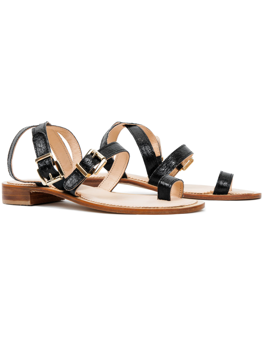 Black coloured, sustainable sandal with golden buckles by ALINASCHUERFELD