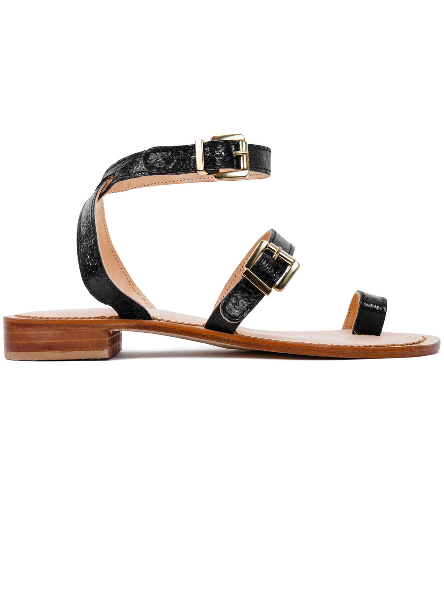 Black coloured, sustainable sandal with golden buckles by ALINASCHUERFELD